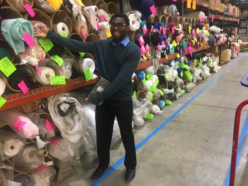 Team member with fabric roles at Hanes factory